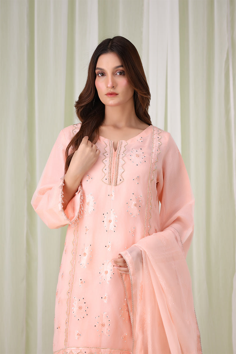 Sanawa Clothing’s peach embroidered shalwar kameez with matching dupatta, showcasing refined craftsmanship and timeless elegance.